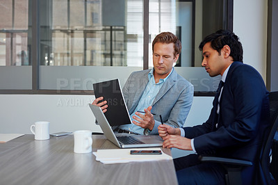 Buy stock photo Cropped shot of businessmen working in their office