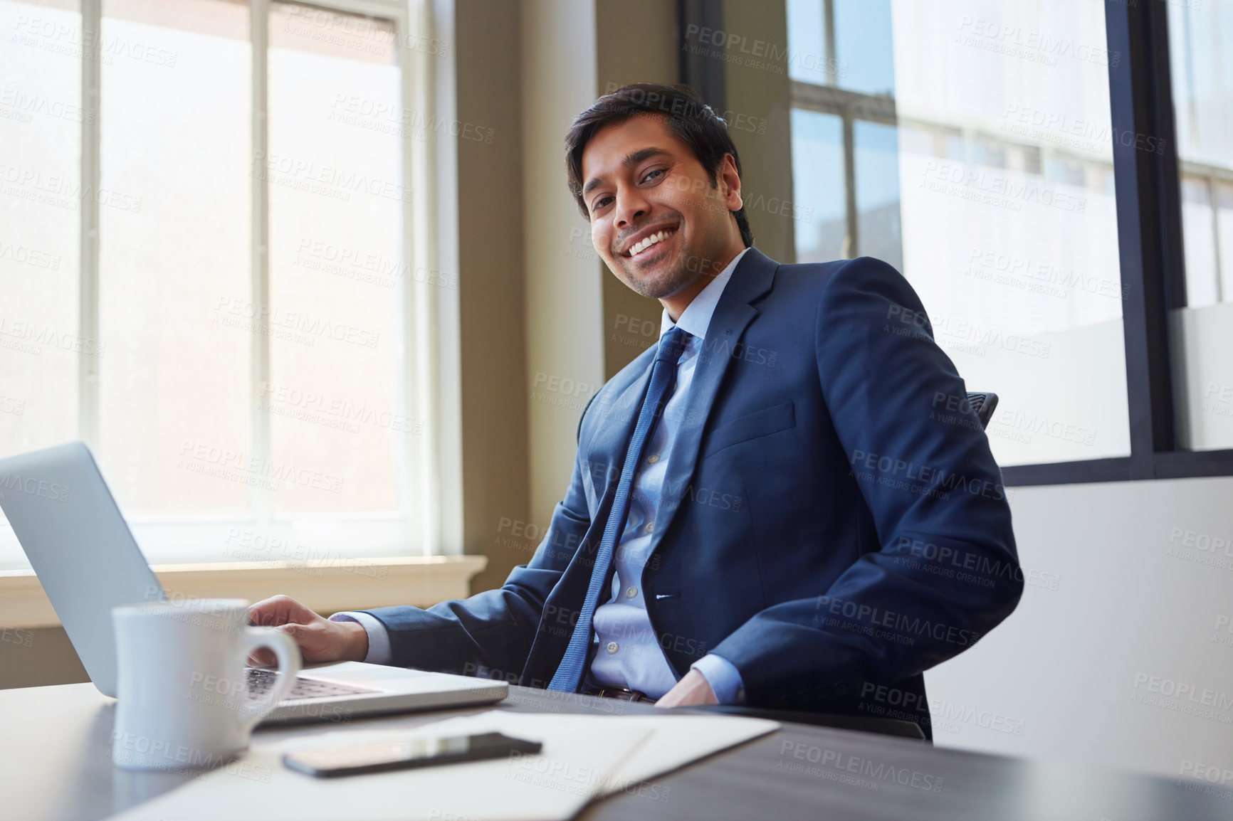 Buy stock photo Cropped portrait of a businessman working in his office