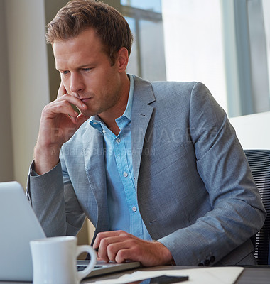 Buy stock photo Cropped shot of a businessman working in his office