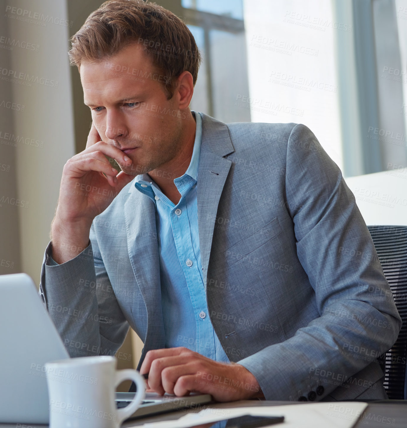 Buy stock photo Cropped shot of a businessman working in his office