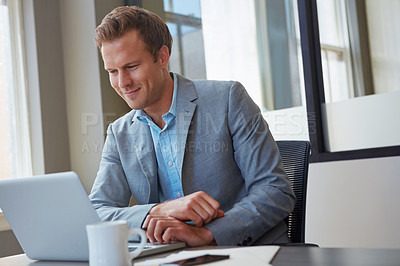 Buy stock photo Cropped shot of a businessman working in his office