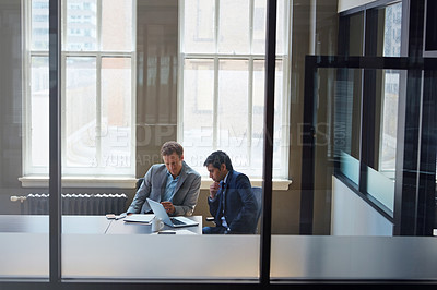 Buy stock photo Cropped shot of businessmen working in their office