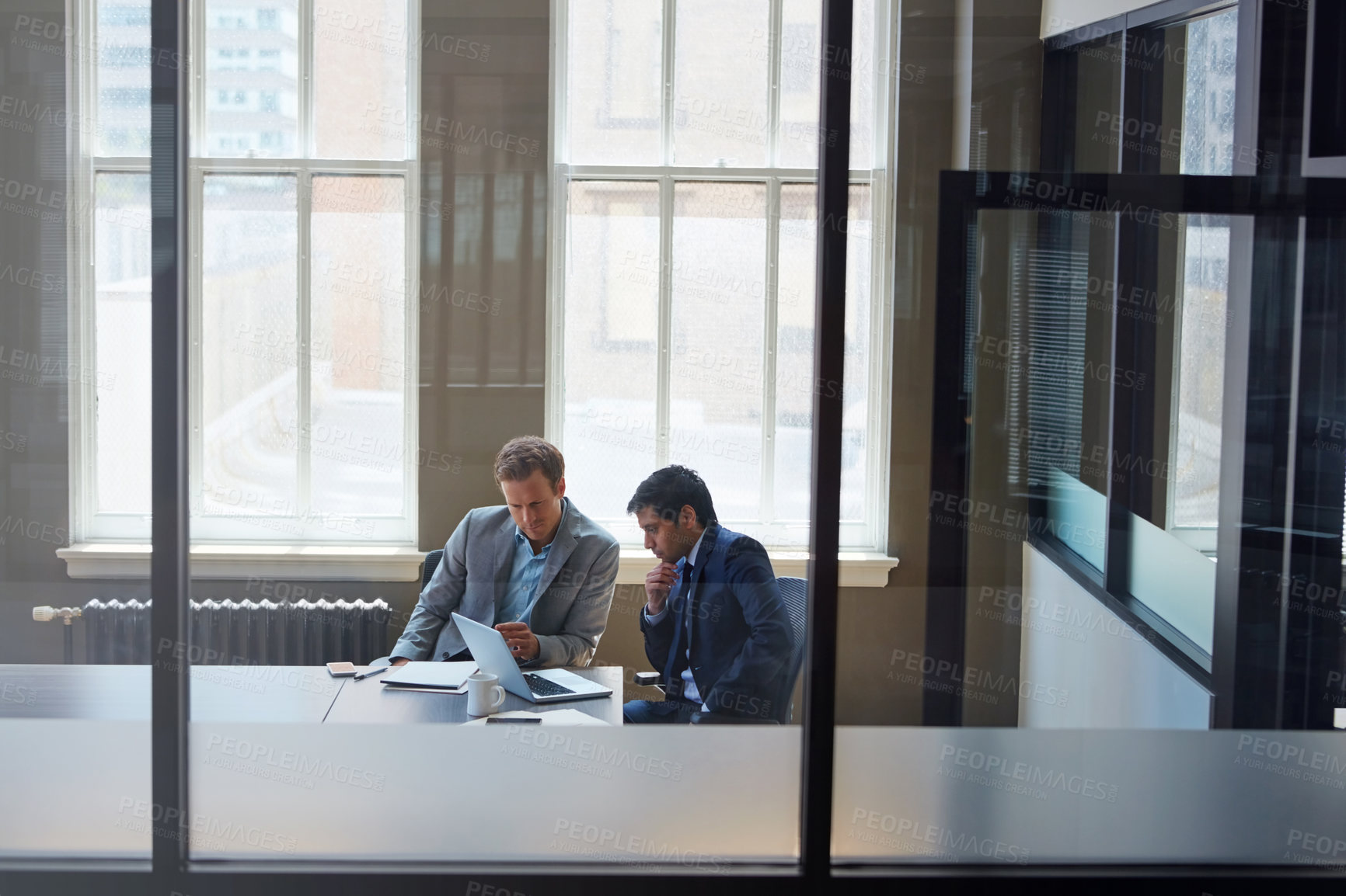 Buy stock photo Cropped shot of businessmen working in their office