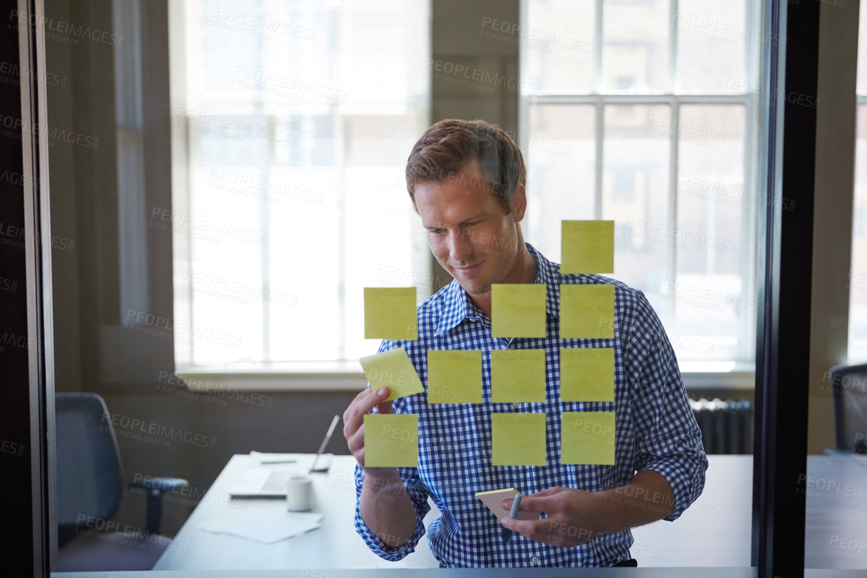 Buy stock photo Sticky note, glass and planning with business man in office for project manager, market forecast and schedule. Progress update, research and timeline mind map with person and wall for trend analysis