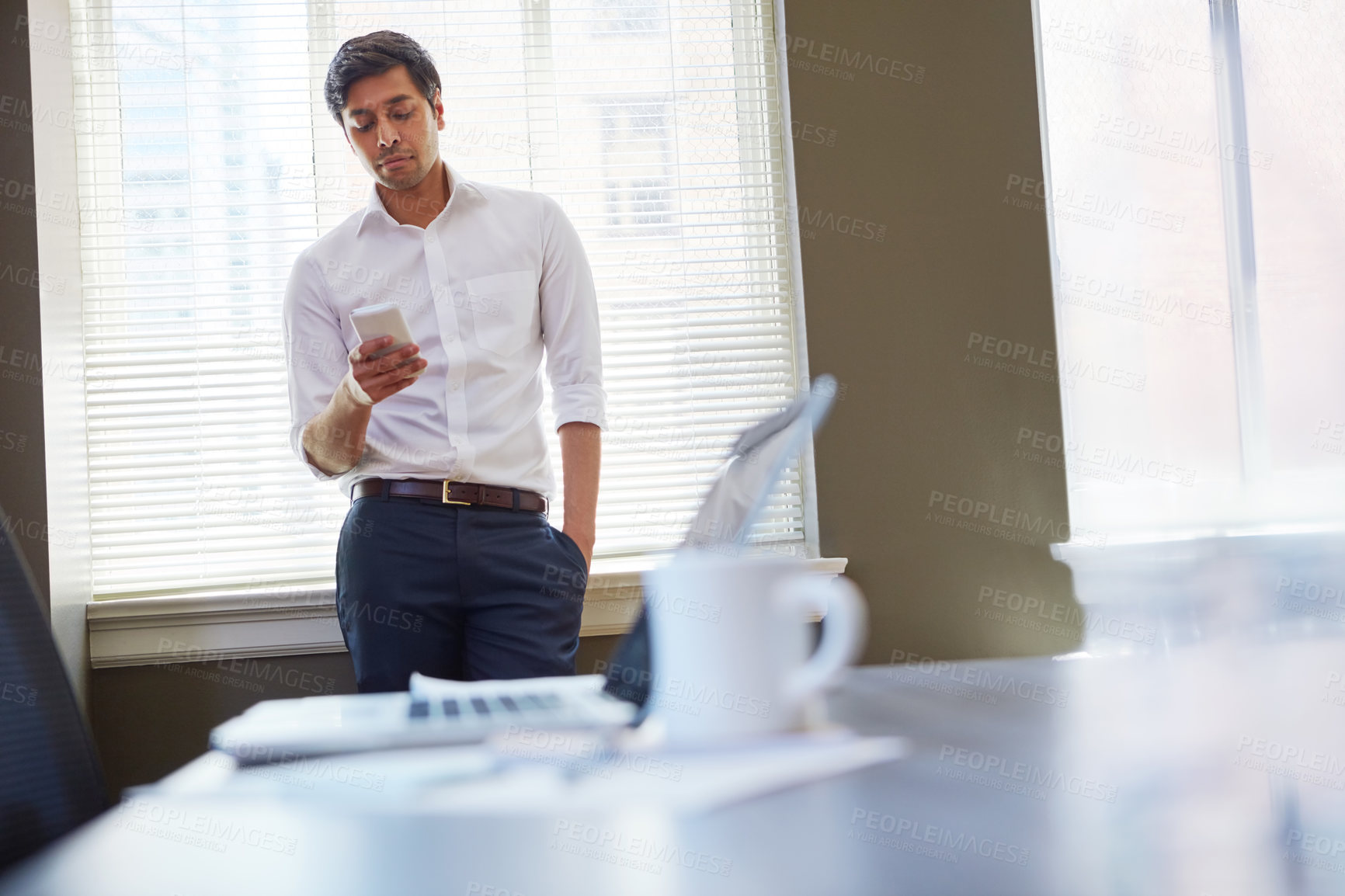 Buy stock photo Business, man and scroll with phone in office for property search, social media update and email. Space, real estate agent and smartphone at work for market trends, client feedback or auction listing