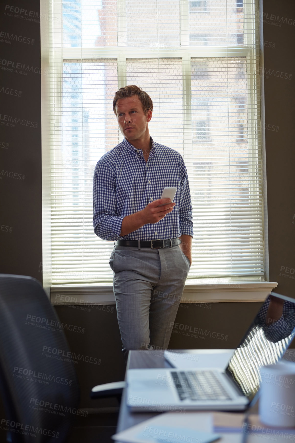 Buy stock photo Man, realtor and thinking in agency with phone, property management and planning in real estate. Agent, mobile and reflection in office for schedule, company development and commercial listing update