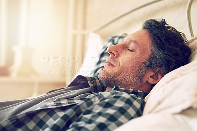 Buy stock photo Cropped shot of a man taking an afternoon nap in bed