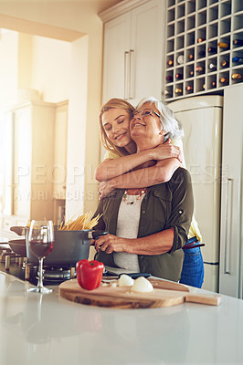 Buy stock photo Hug, mom or happy woman cooking food for a healthy vegan diet together with love in family home. Smile, embrace or adult daughter hugging or helping senior mother in house kitchen for lunch or dinner