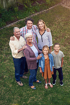 Buy stock photo High angle portrait of a family spending time together in their backyard