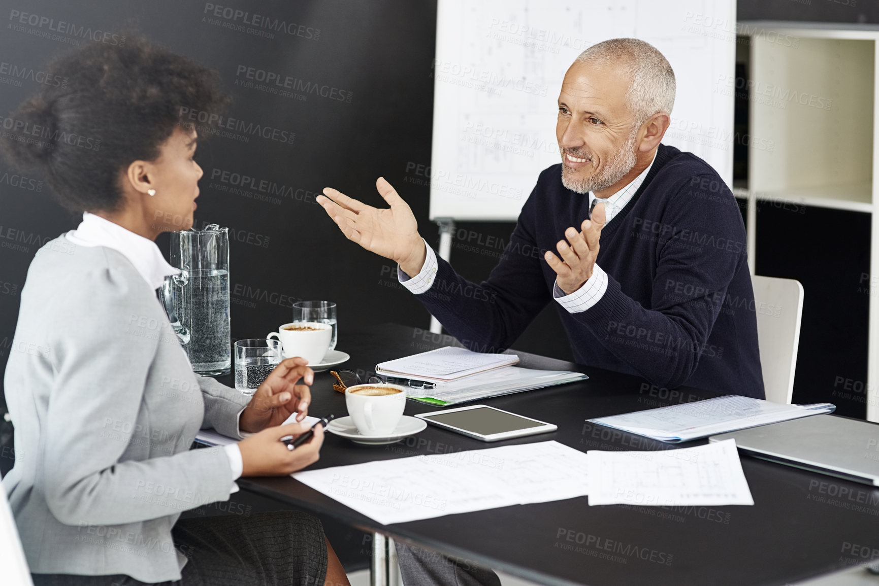 Buy stock photo Mature CEO, woman or business people with paperwork in office for talking or speaking of documents. Team, mentor and financial consultants in conversation, communication and discussion in workplace