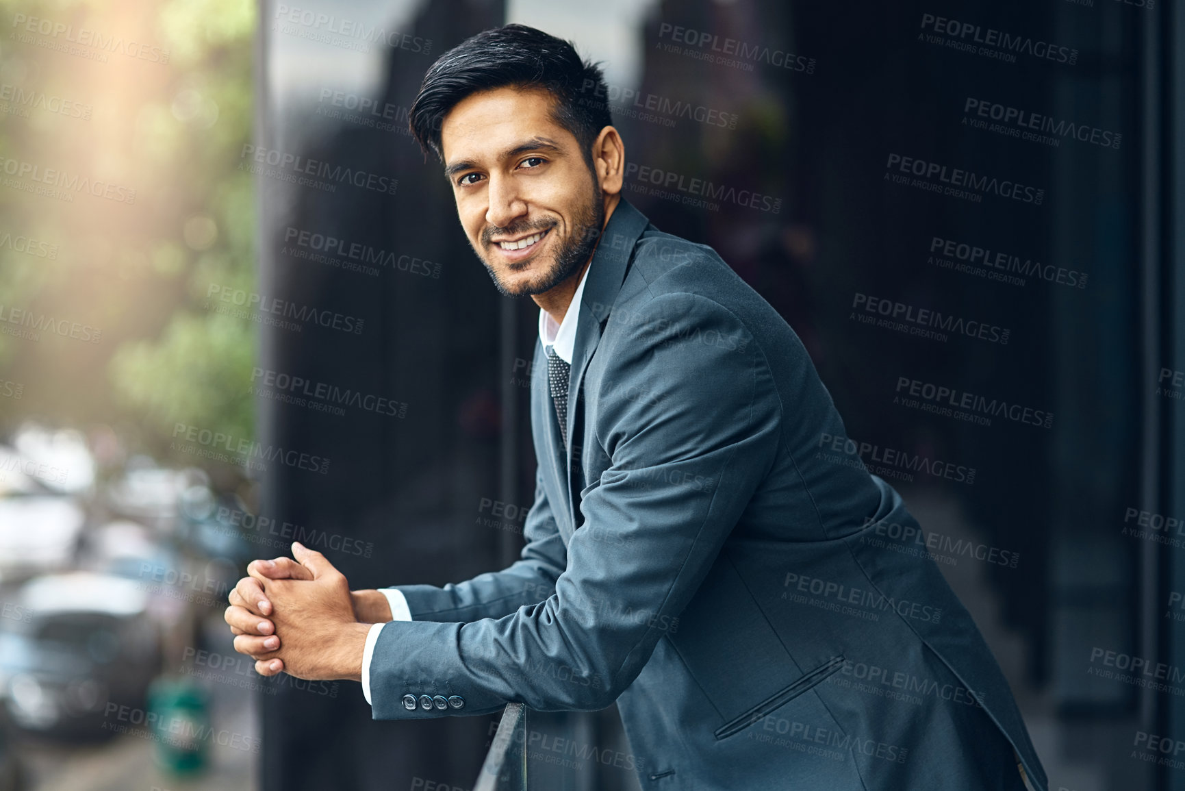 Buy stock photo City, happy and portrait of business man on balcony for working, career and job. Professional workplace, corporate lawyer and serious person with confidence, company pride and opportunity in India