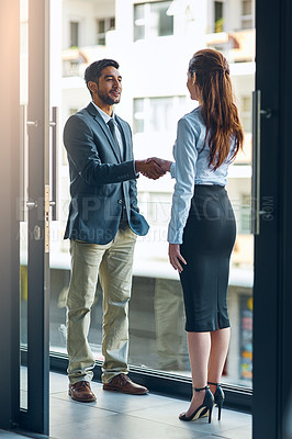 Buy stock photo Handshake, meeting and business man and woman in office for teamwork, collaboration and partnership. Corporate office, professional and people shaking hands for agreement, b2b deal and thank you