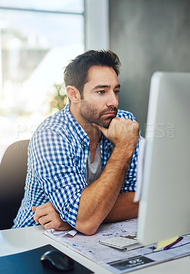 Buy stock photo Cropped shot of a businessman working on a computer in a modern office