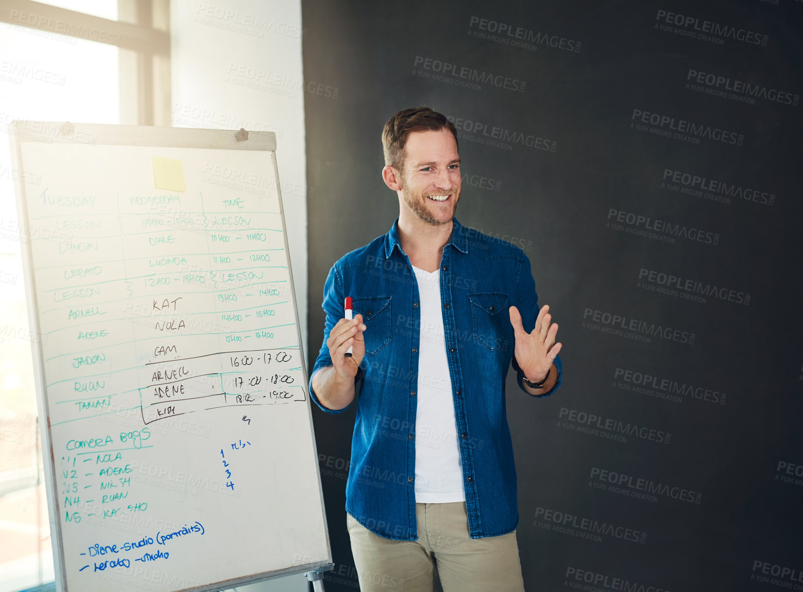 Buy stock photo Cropped shot of a young businessman giving a presentation in an office