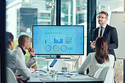 Buy stock photo Cropped shot of a businessman delivering a presentation in the boardroom