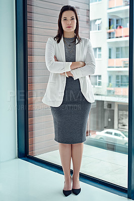 Buy stock photo Portrait of a successful businesswoman standing in their office