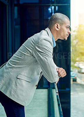 Buy stock photo Shot of a young businessperson standing in their office