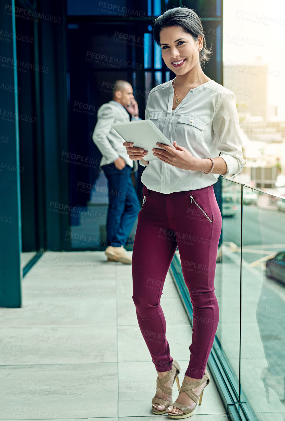 Buy stock photo Portrait of a young businesswoman using a digital tablet at work