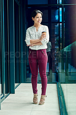 Buy stock photo Shot of a young businesswoman having a coffee break at work
