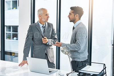 Buy stock photo Cropped shot of two businessmen meeting in their office