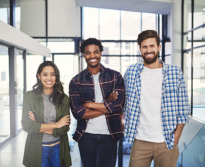 Buy stock photo Portrait of three young designers standing together in a modern office