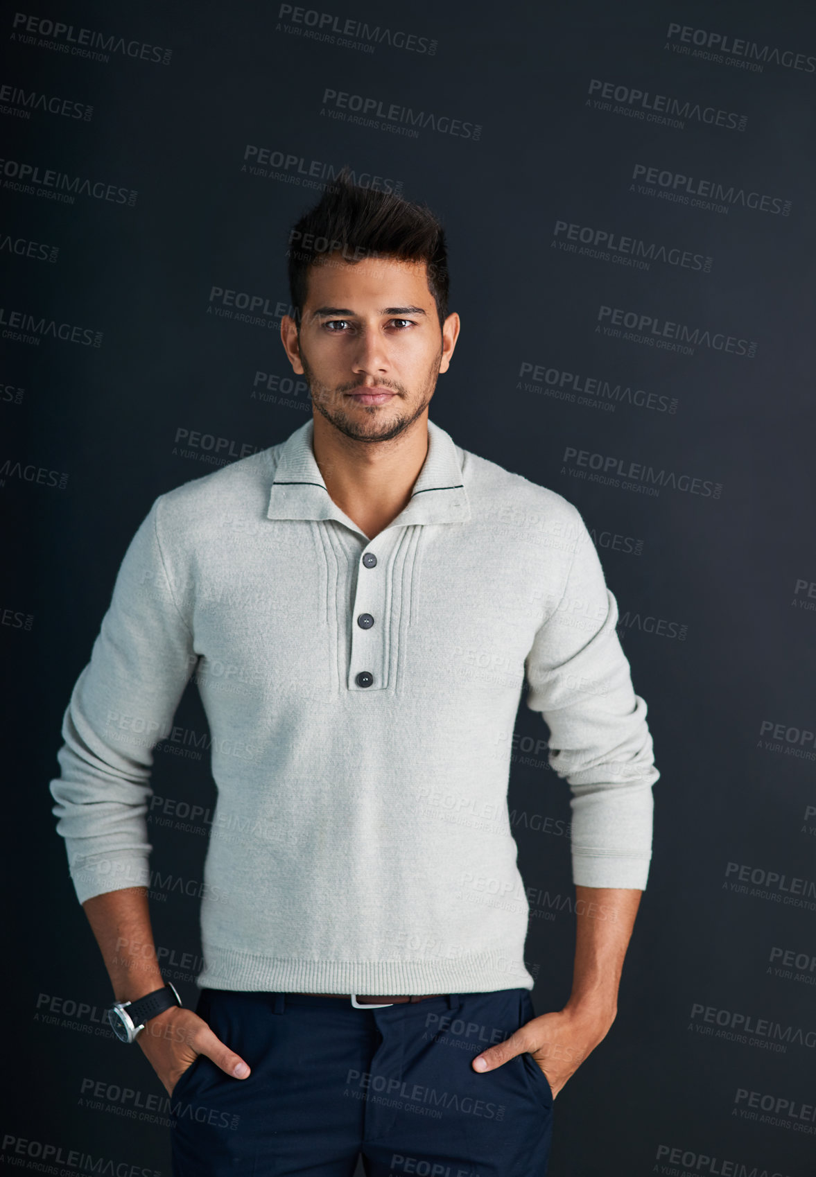 Buy stock photo Studio shot of a handsome young man against a dark background