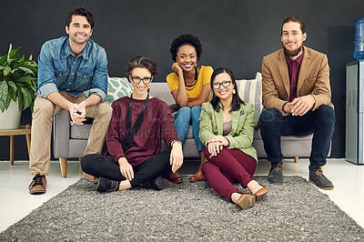 Buy stock photo Portrait of a group of young creatives sitting together in an office