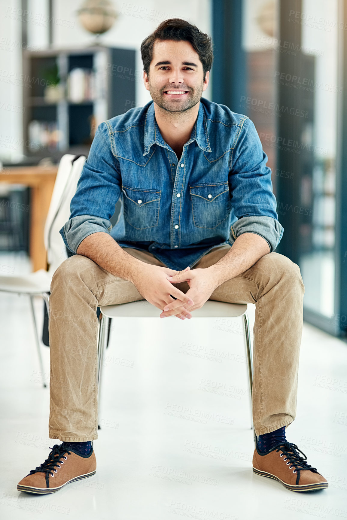 Buy stock photo Man, portrait and consultant in office on chair, project and event planner in creative business. Male person, entrepreneur and happy employee in workplace, confidence and proud of career opportunity