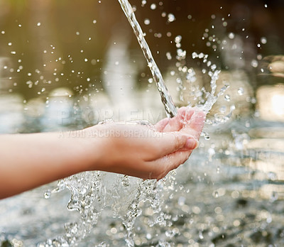 Buy stock photo Cropped shot of hands held out under a stream of water
