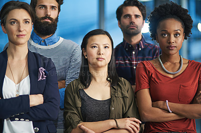 Buy stock photo Cropped shot of a group of creative businesspeople looking determined