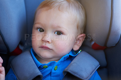 Buy stock photo Portrait of an adorable baby boy sitting in a car seat