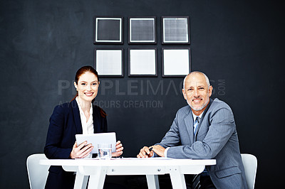 Buy stock photo Business people, portrait and wall background at desk teamwork or interior design, agency or tablet. Man, woman and digital project planning with office collaboration on website, startup or online