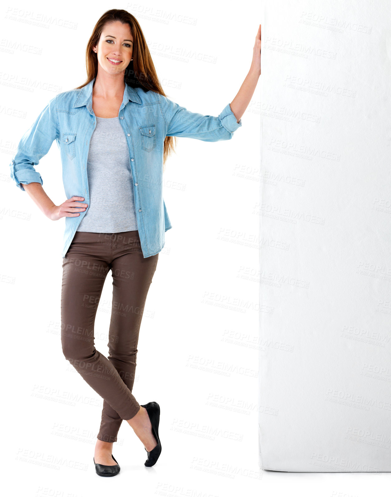 Buy stock photo Fashion, denim and portrait of woman in studio leaning on wall for happiness, confidence or billboard with white background. Smile, mockup space and model with shirt, comfortable or trendy clothes