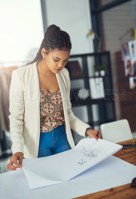 Buy stock photo Shot of a successful young fashion designer working on her latest creation
