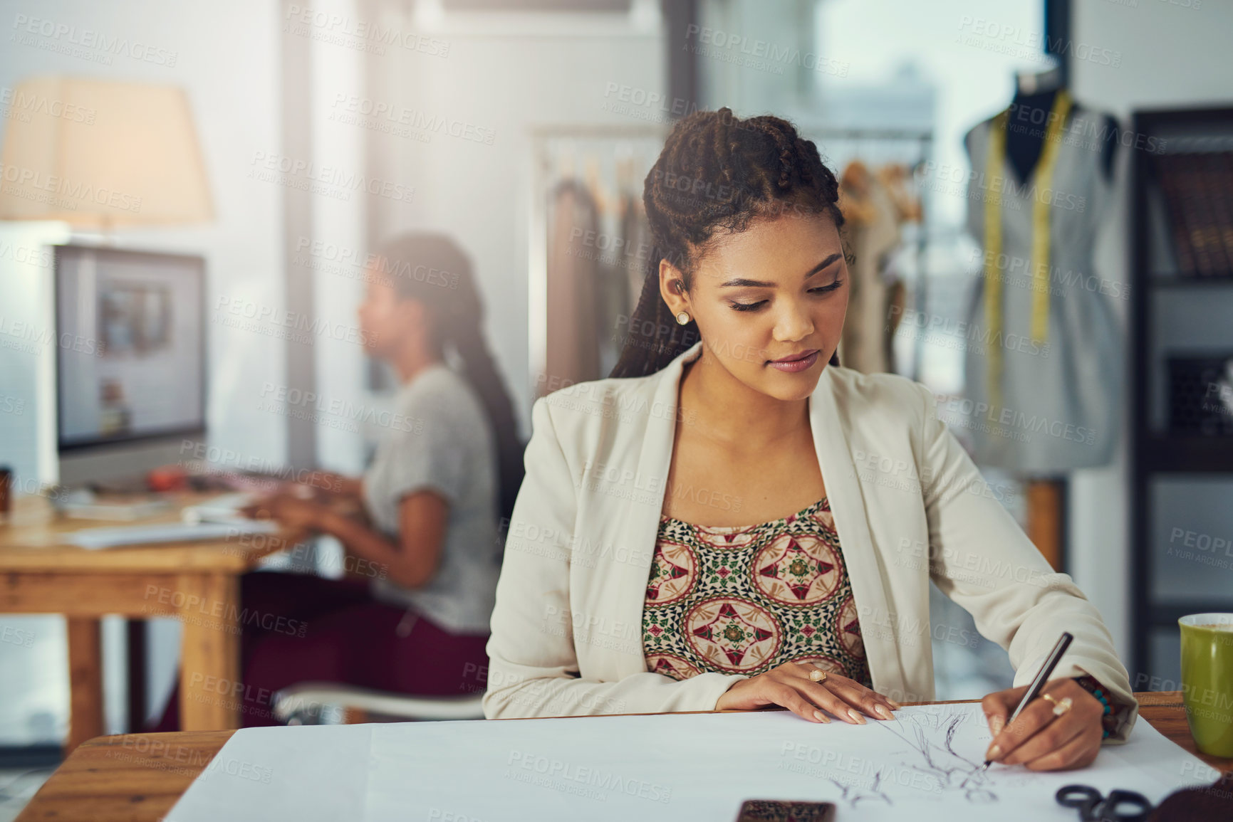 Buy stock photo Shot of a successful young fashion designer working on her latest creation