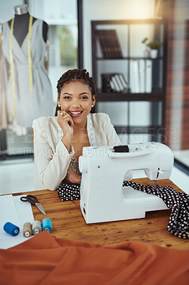 Buy stock photo Cropped portrait of a young fashion designer using a sewing machine in her workshop
