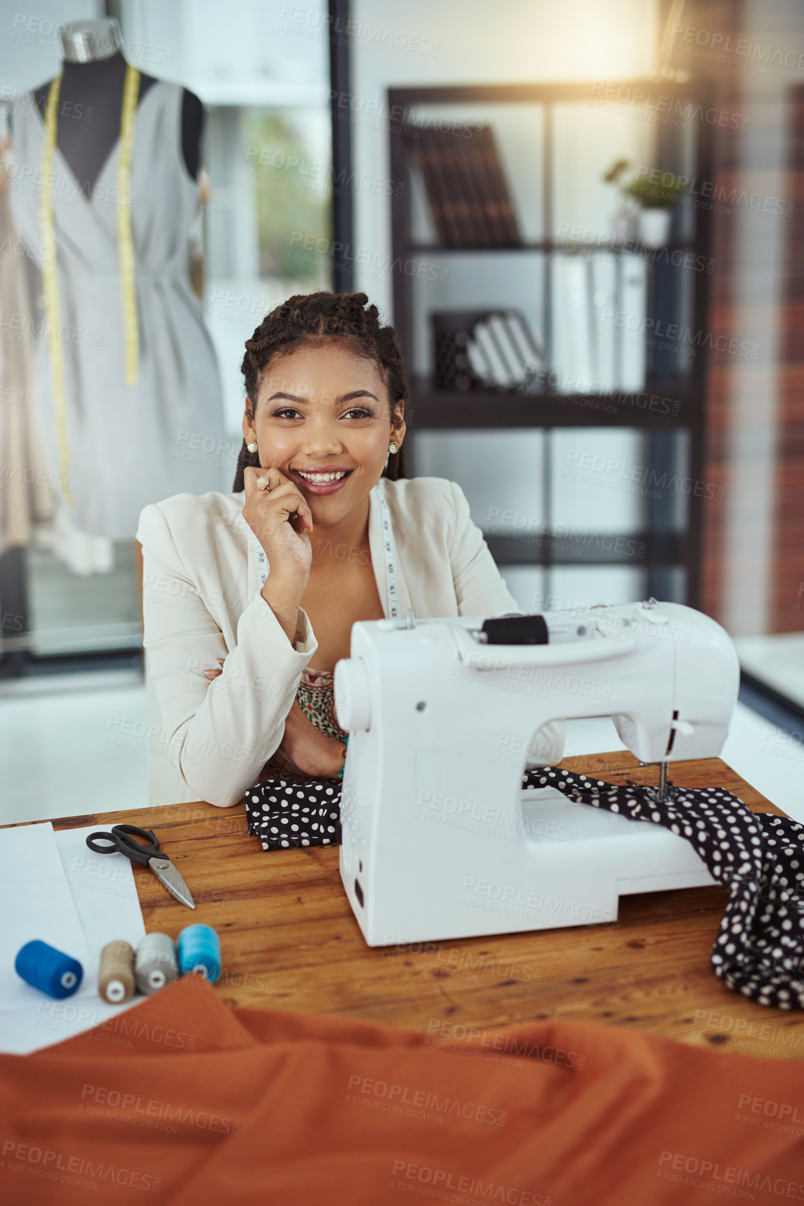 Buy stock photo Happy woman, portrait and fashion designer with sewing machine for clothing production, manufacturing or garment at workshop. Female person, seamstress or dressmaker with smile for handmade fabric