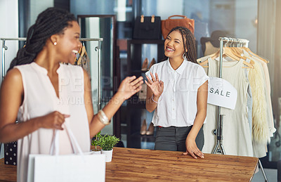 Buy stock photo Cropped shot of a cashier and a customer waving goodbye to each other