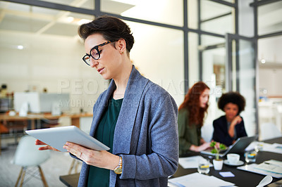 Buy stock photo Business, woman and tablet in boardroom with glasses for creative research, schedule check or office planning. Young professional, reading and online article for project, communication and web search