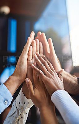Buy stock photo Cropped shot of a group of unrecognizable colleagues giving each other a high five