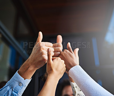 Buy stock photo Cropped shot of various businesspeople's hands showing thumbs up