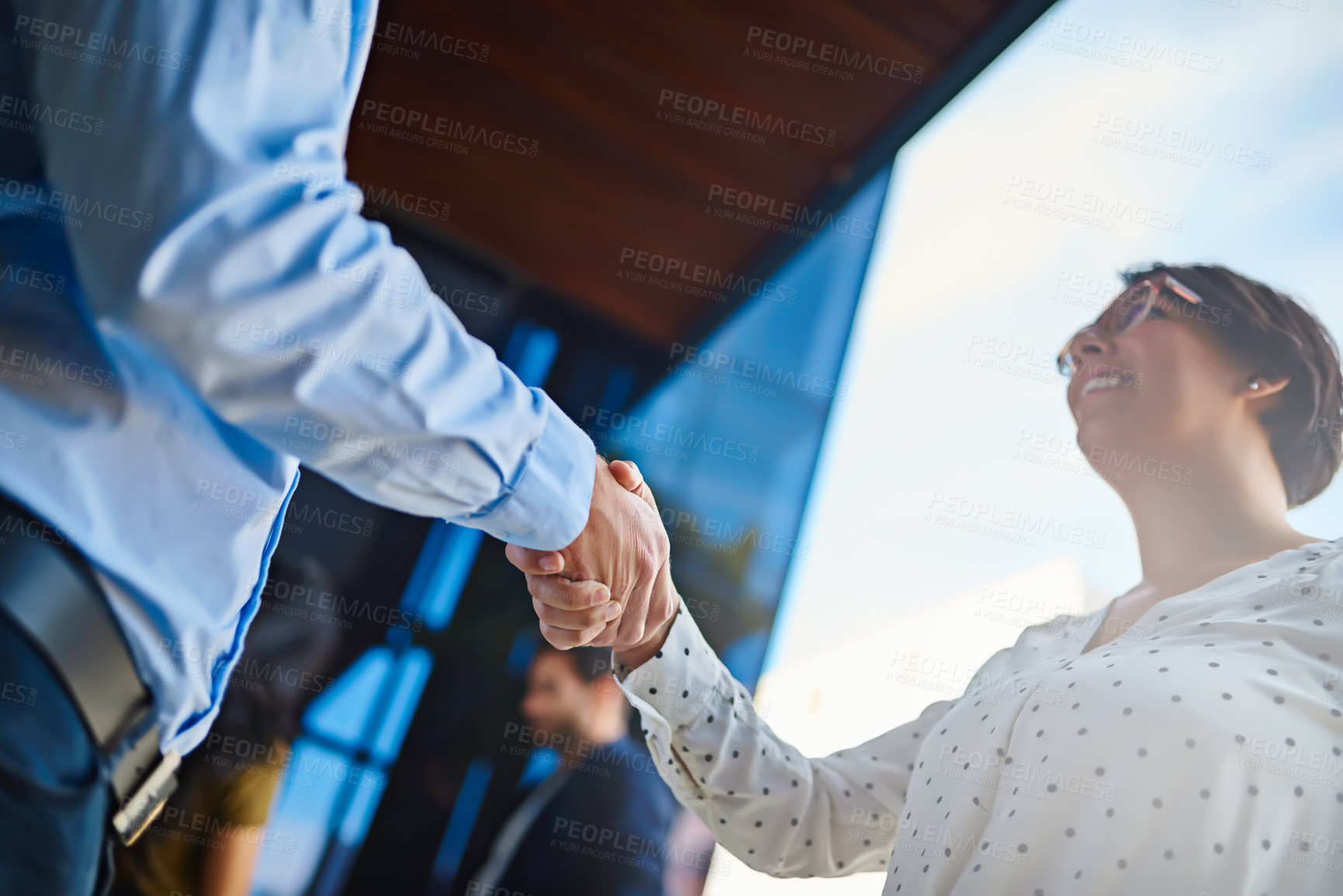 Buy stock photo Handshake, low angle and business people on office balcony for welcome, collaboration and partnership. Corporate, meeting and man and woman shaking hands for agreement, b2b networking and thank you