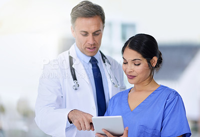 Buy stock photo Hospital, consulting and doctor with nurse on tablet for medical service, help and diagnosis results. Healthcare, clinic and man and woman talk with digital tech for research, planning and telehealth