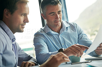 Buy stock photo Business talk, meeting and team talking about information on paper for corporate planning and strategy. Man and partner talking about finance collaboration with paperwork during office conversation