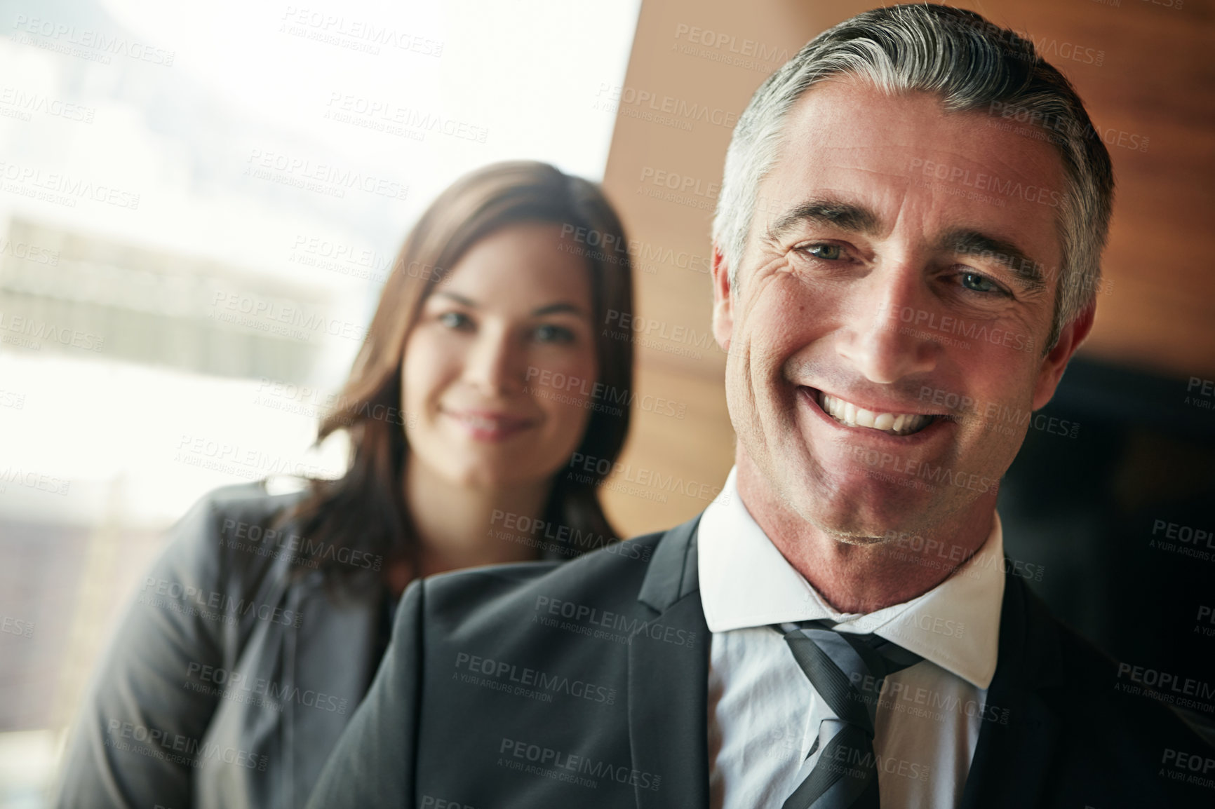 Buy stock photo Portrait of a team of professionals standing together in an office