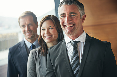 Buy stock photo Shot of a team of professionals standing together in an office