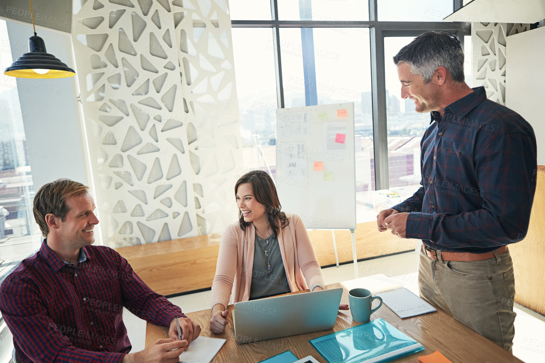 Buy stock photo Shot of a group of businesspeople having a meeting