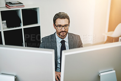 Buy stock photo Business man, computer and reading in office for information technology, software or online programming. Serious programmer or web developer in glasses with desktop for analysis, solution or research