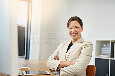 Buy stock photo Portrait of a confident businesswoman working at her desk