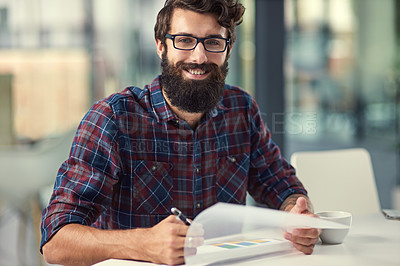 Buy stock photo Documents, portrait and writing with designer man in office for artistic project management. Design, paper and smile of happy young employee with beard in creative workplace for proposal development
